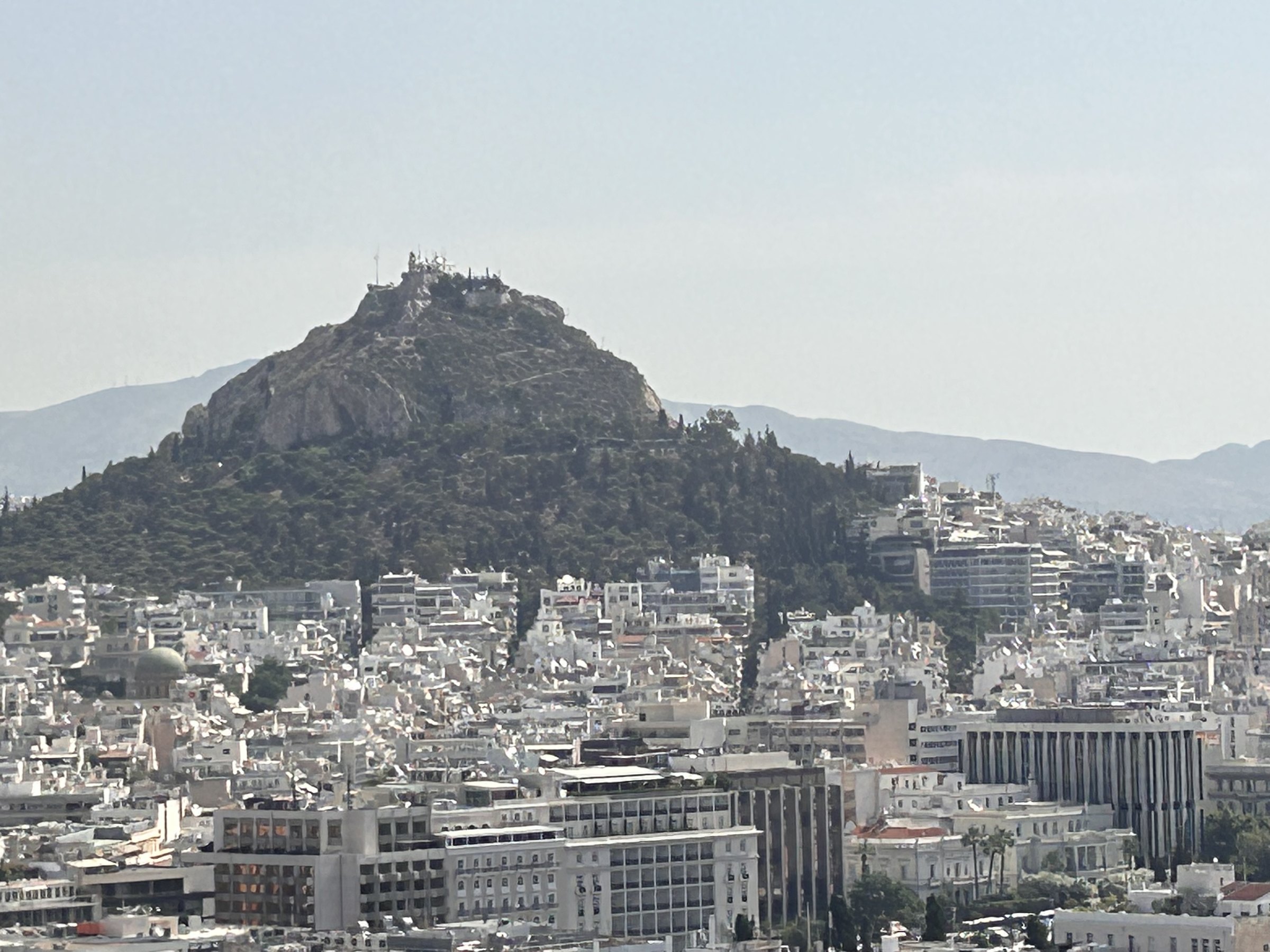Lycabettus Hill rising above the white buildings of Athens