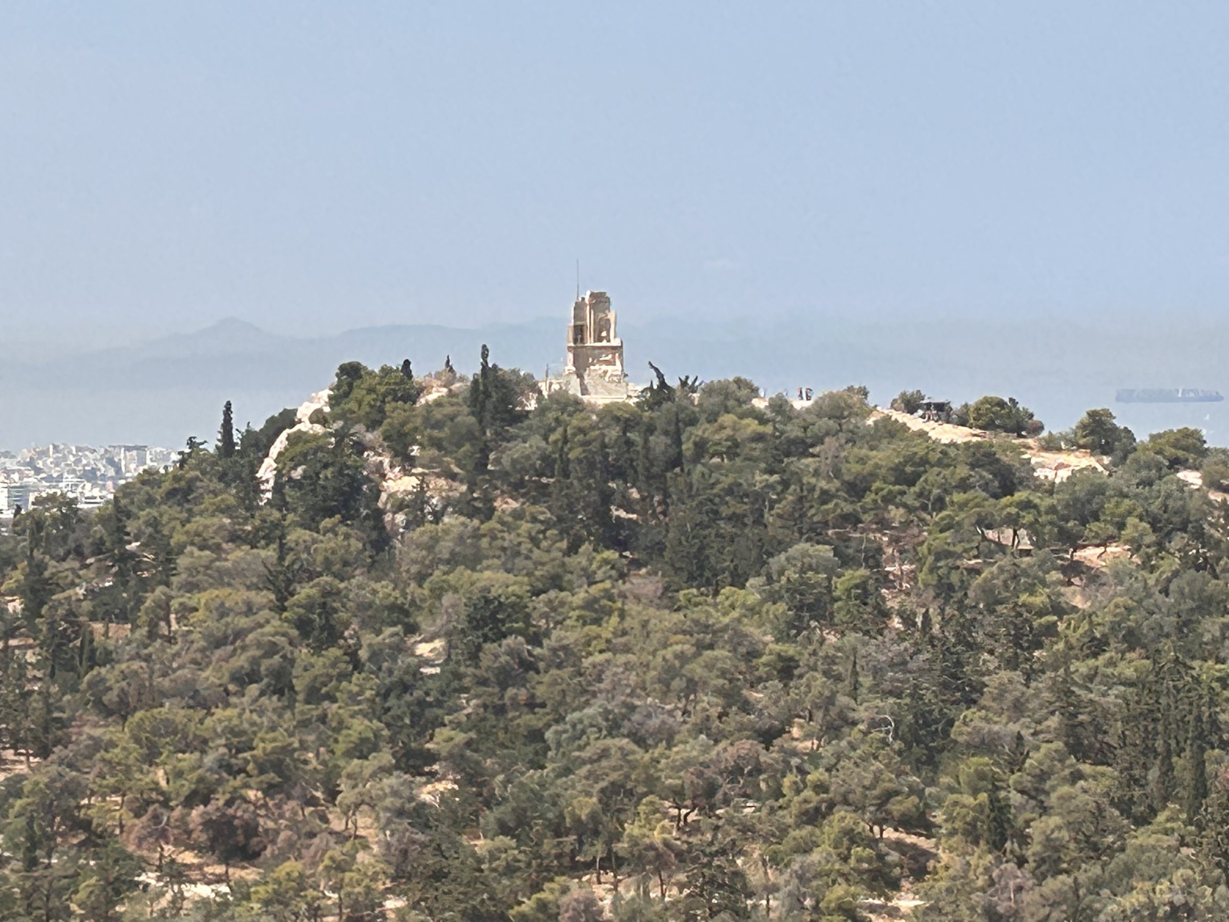 Philopappos Monument standing on a green hill above Athens