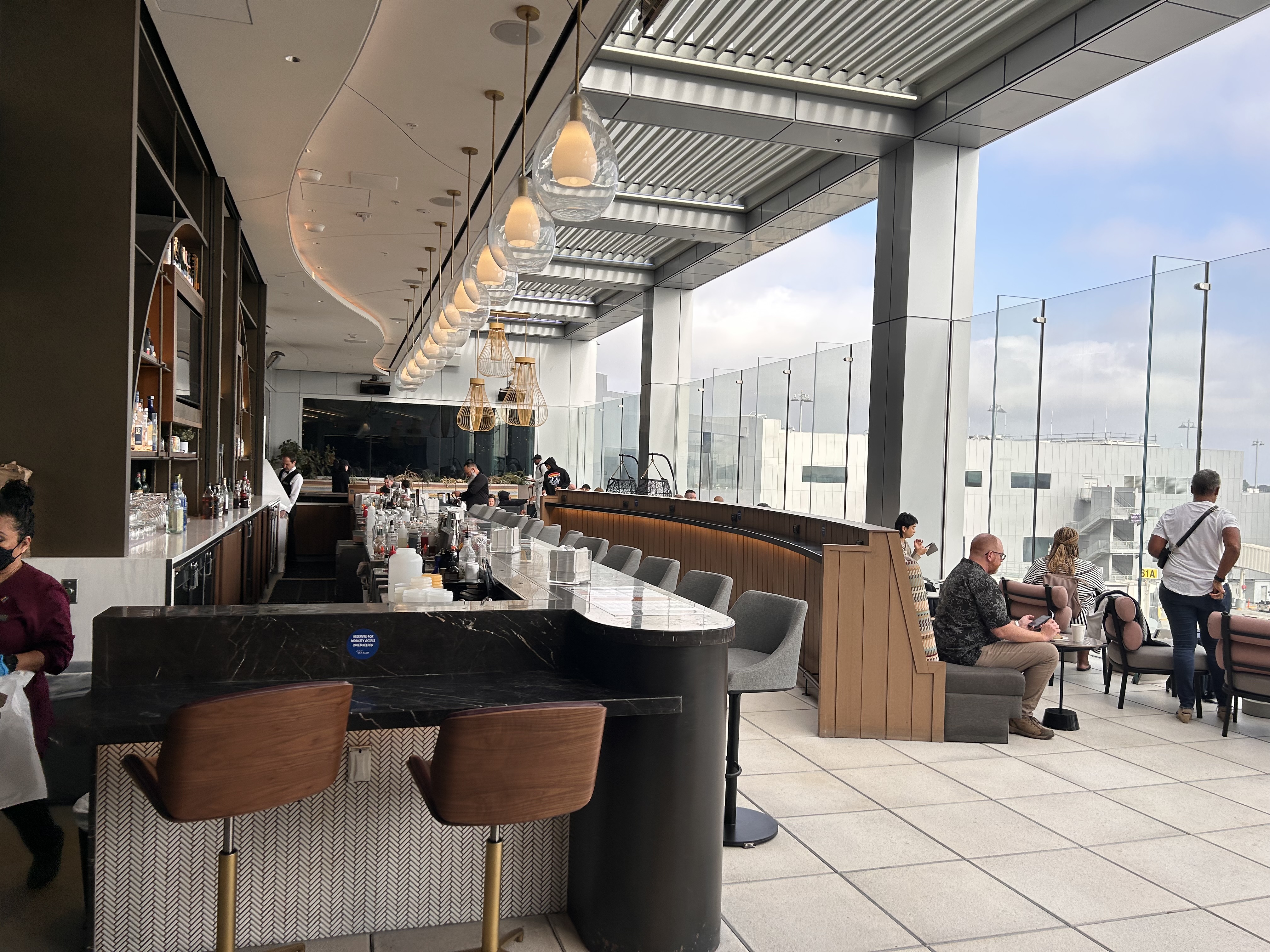 The bar and terrace inside the Delta Sky Club at Los Angeles International Airport