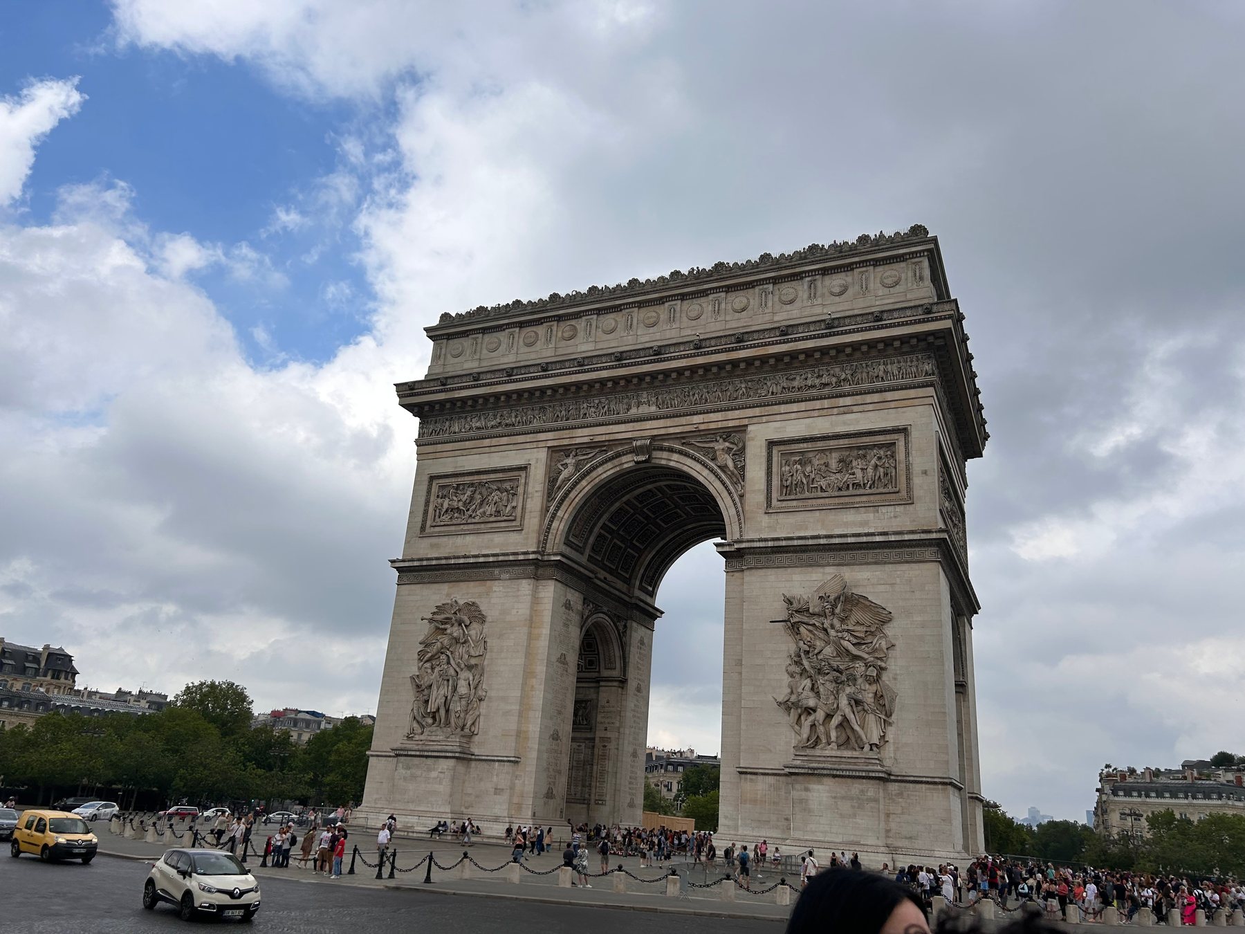The Arc de Triomphe beneath a dramatic Paris sky