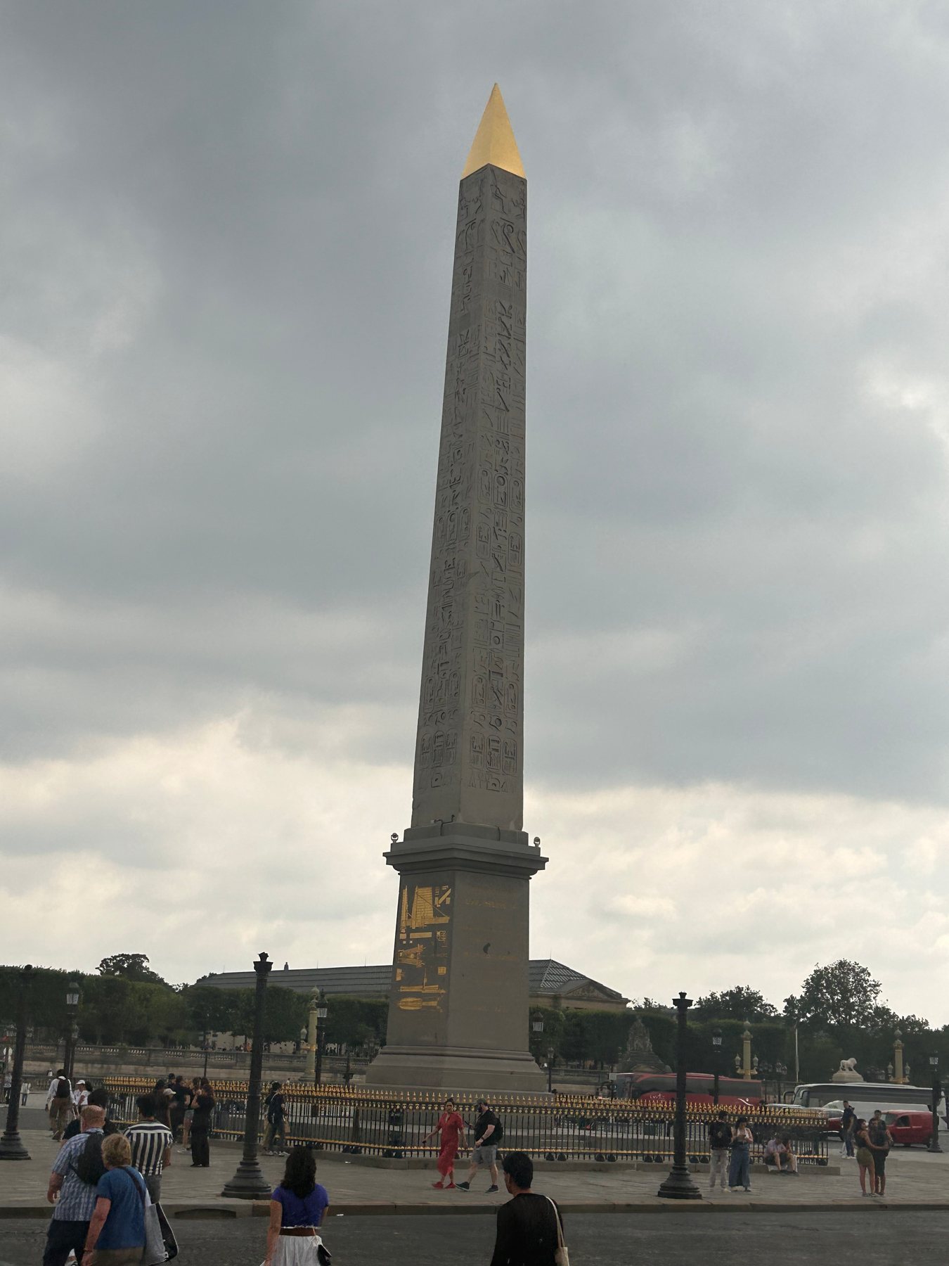 The Luxor Obelisk at Place de la Concorde beneath cloudy skies