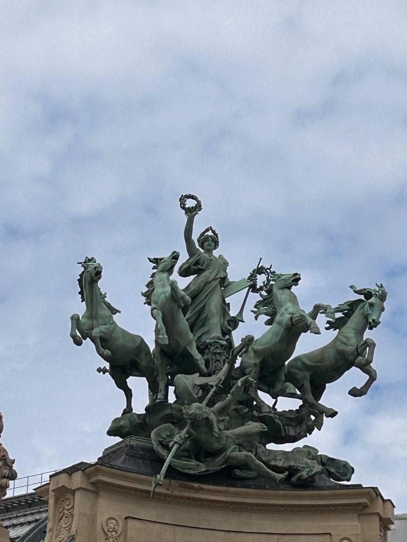 Ornate bronze sculpture crowning Pont Alexandre III in Paris