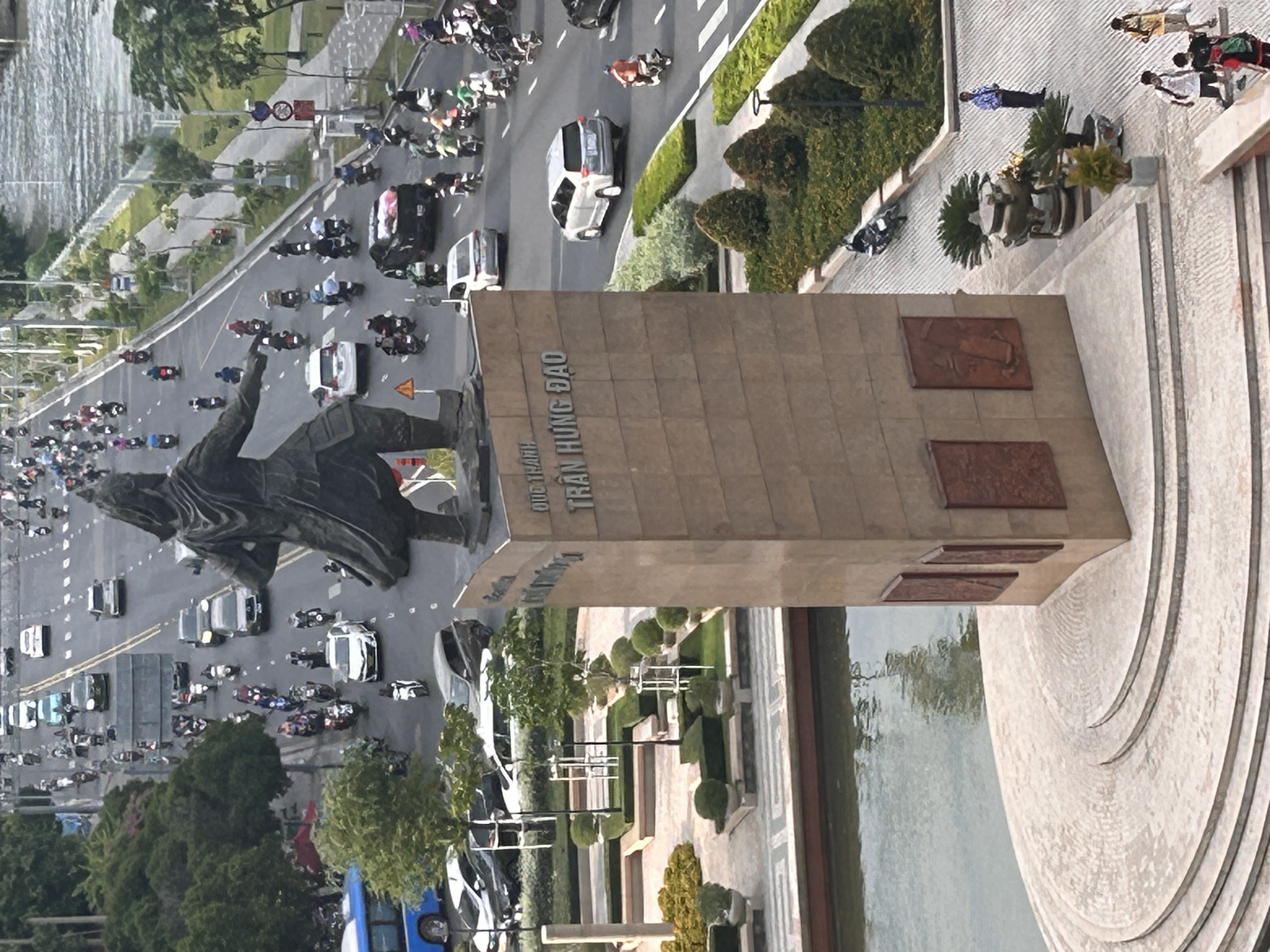 Tran Hung Dao monument surrounded by traffic near the Saigon River