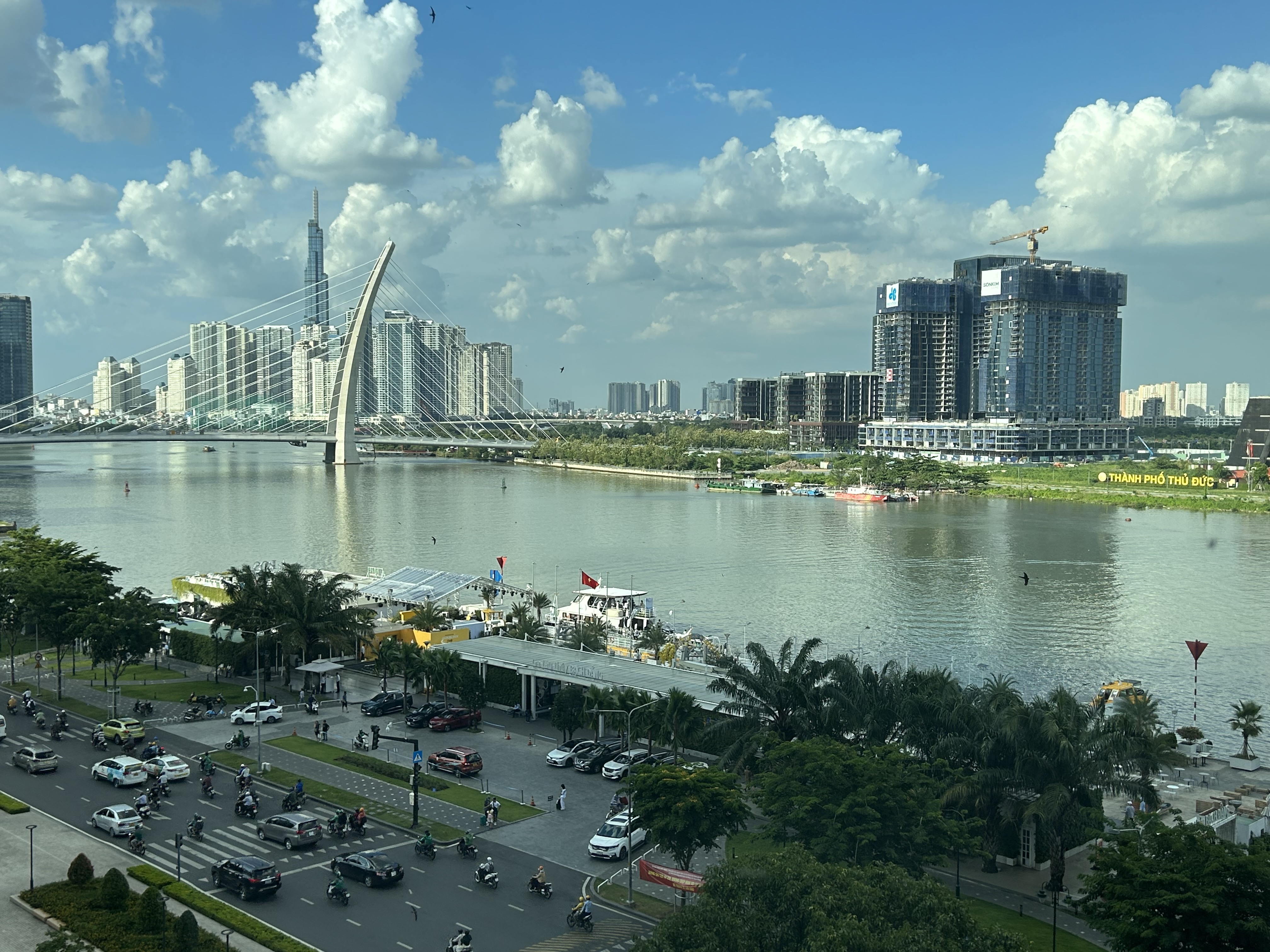 Modern Saigon skyline, bridge, river, and traffic seen from the Renaissance Riverside Hotel